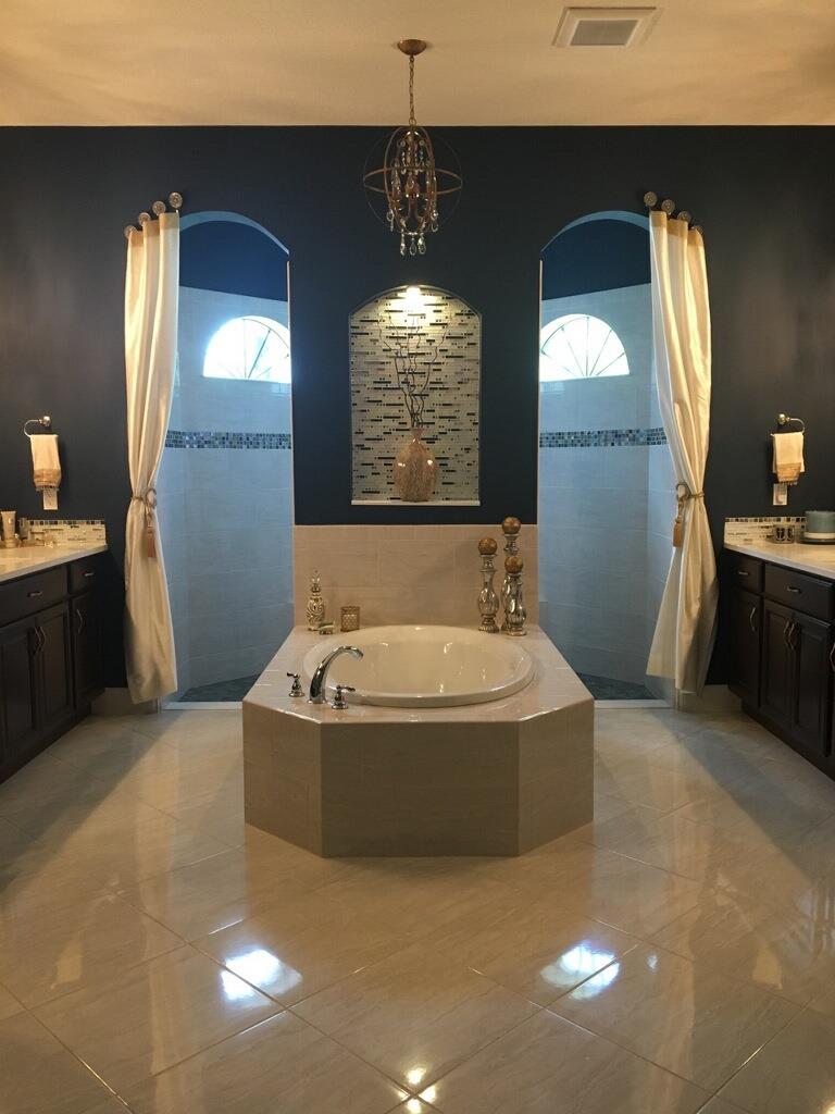 Bathroom with dark blue painted walls and tile floor
