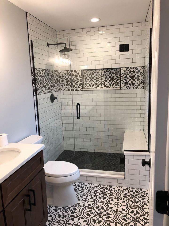 White and black patterned tile shower