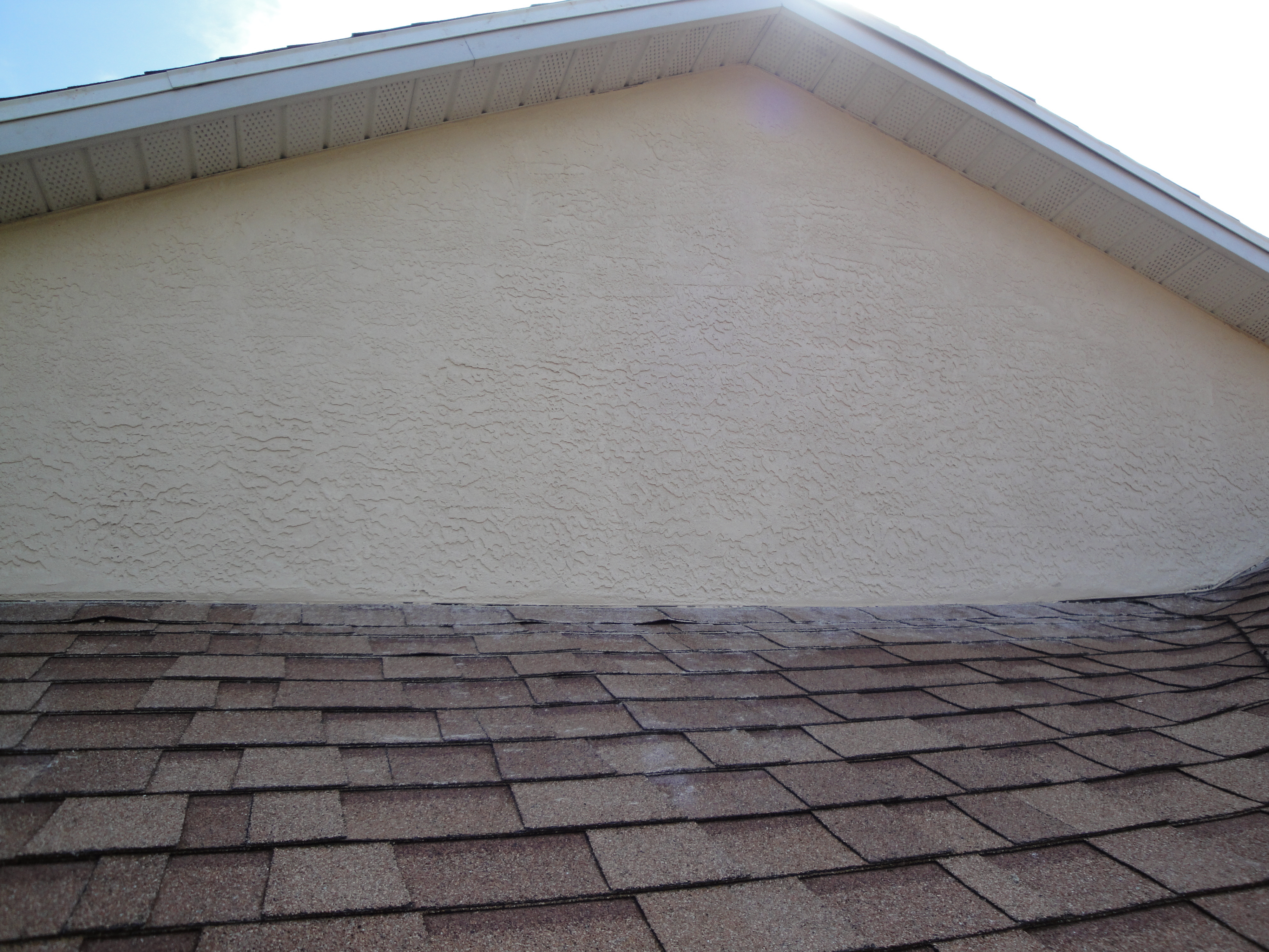 Completed stucco patch on a Palm Coast home exterior wall