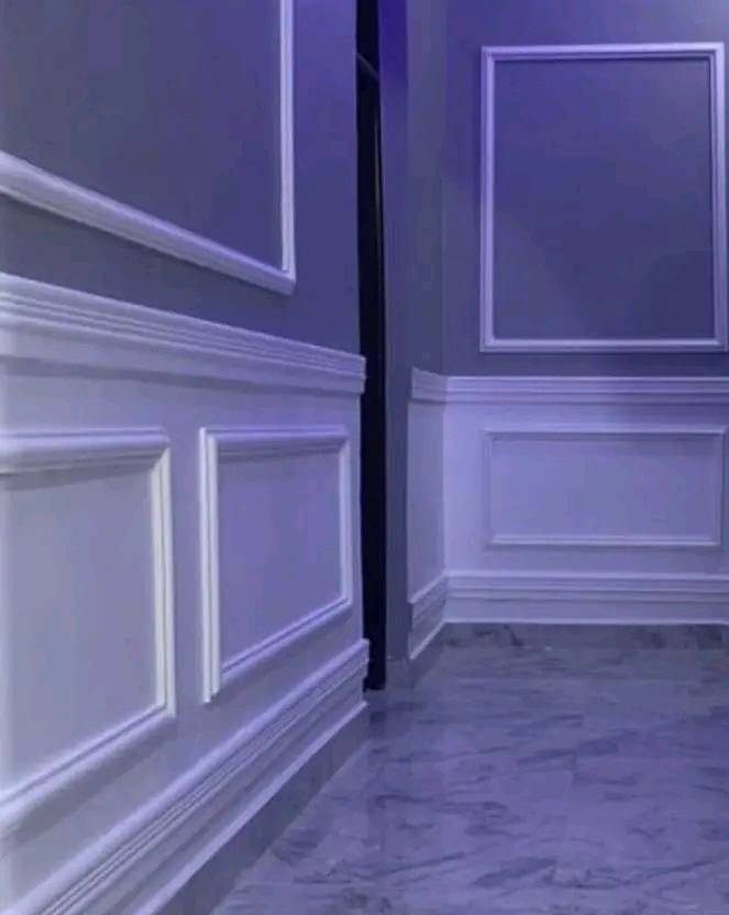 Decorative picture-frame molding installed on a painted wall