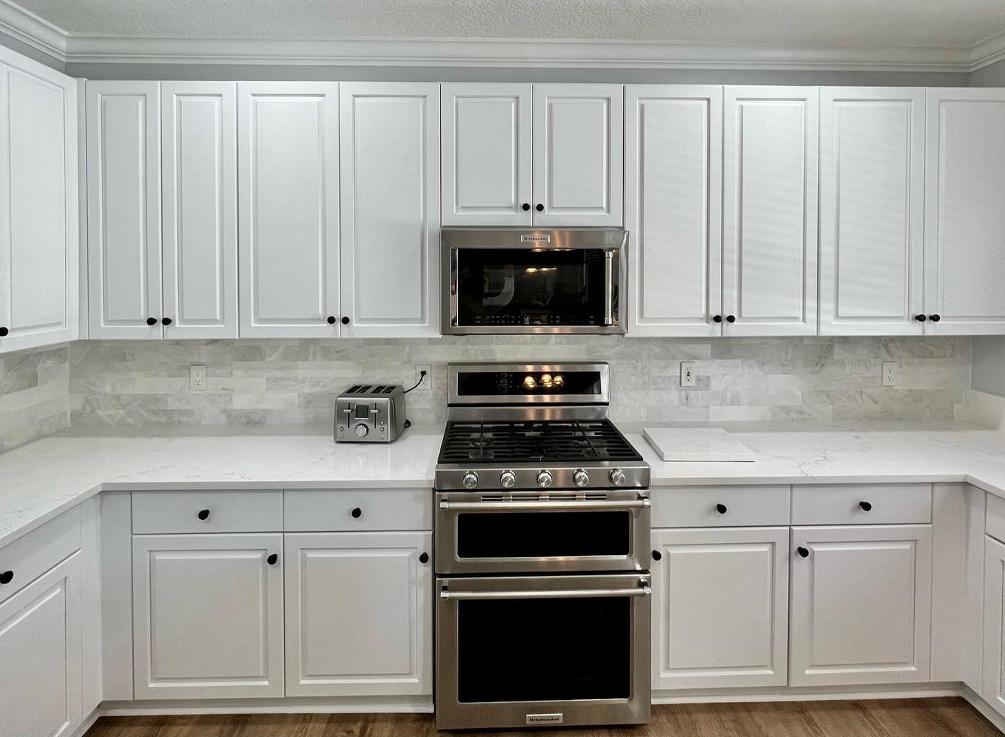 White kitchen with tile backsplash